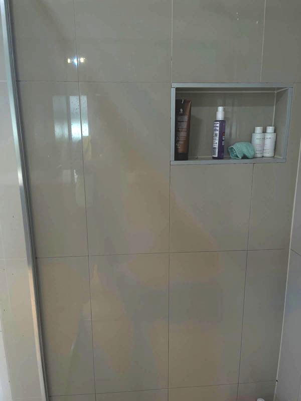 Shower wall tiles and recessed niche cleaned