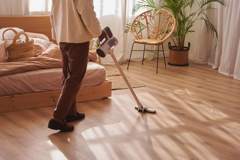 Regular cleaning Sydney — vacuuming a hallway floor